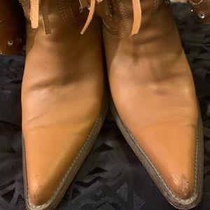 Worn ladies cowboy boots.